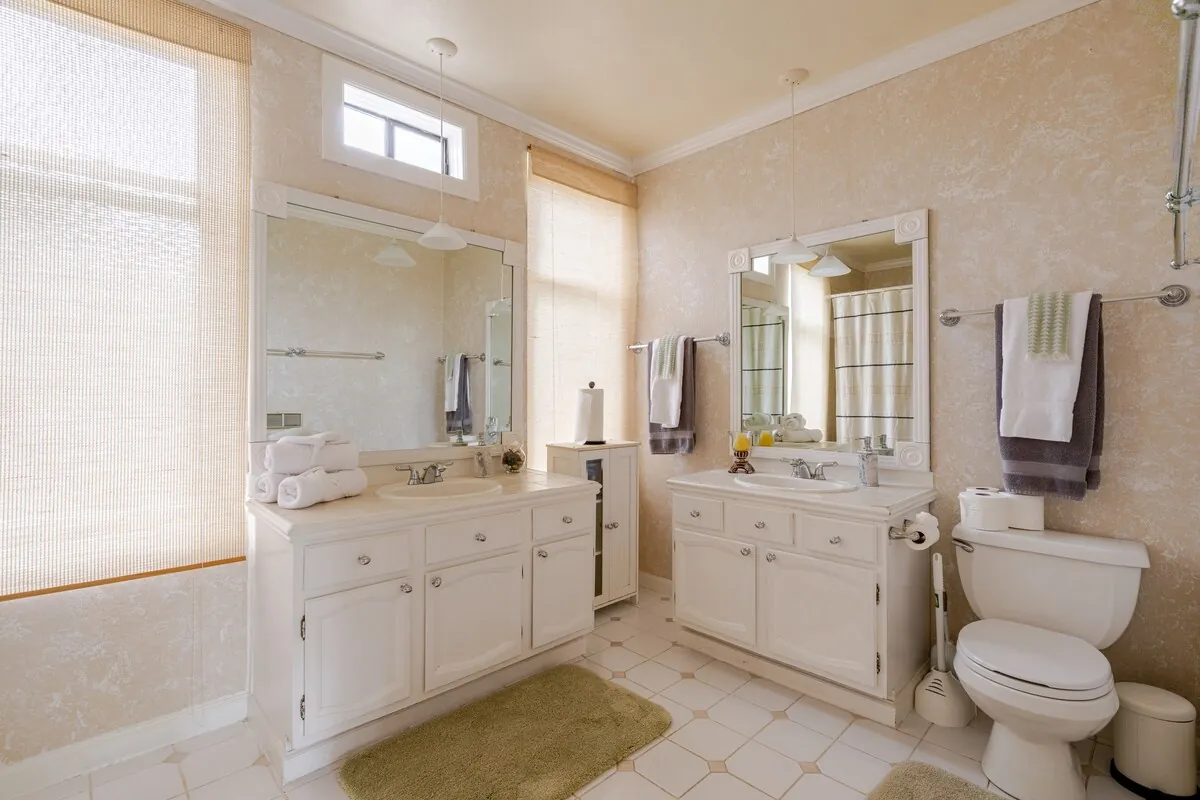 Bathroom with double vanity and natural light