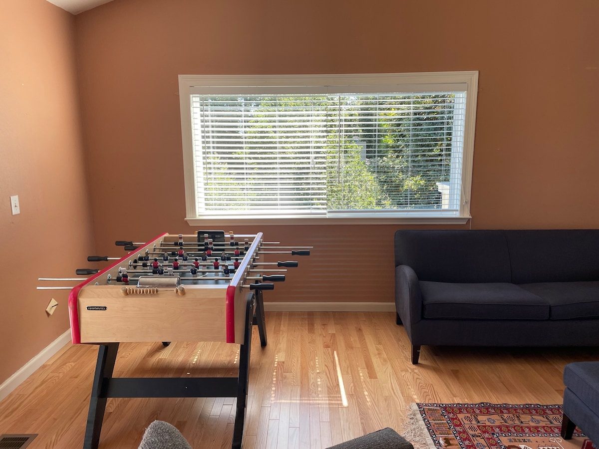 Game room lounge with foosball and couch
